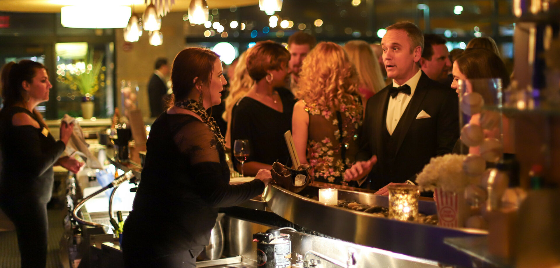 bartender serving guest at a gala event