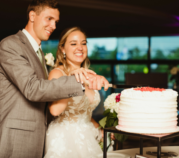 couple cutting wedding cake