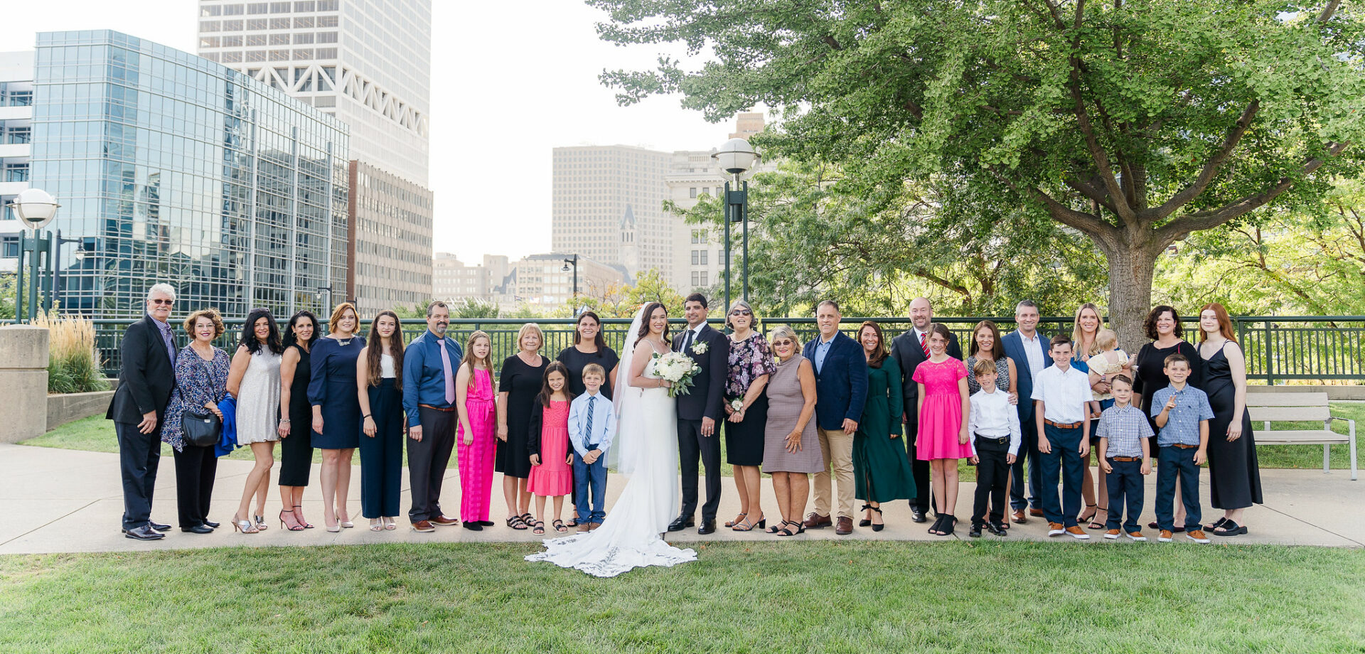 wedding couple and family with milwaukee skyline